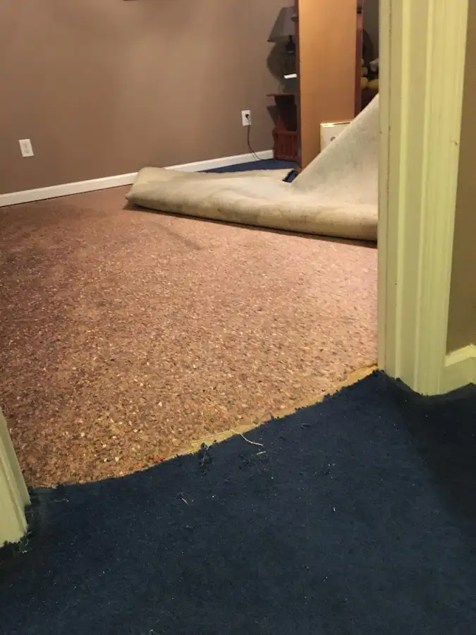 Carpet pad removal revealing water damage during Water Mitigation Services in West Rancho Dominguez